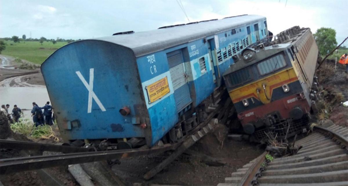 27 die as 2 trains derail, coaches fall into river